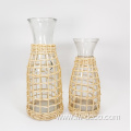 large ratten wrapped clear glass bottles with handle